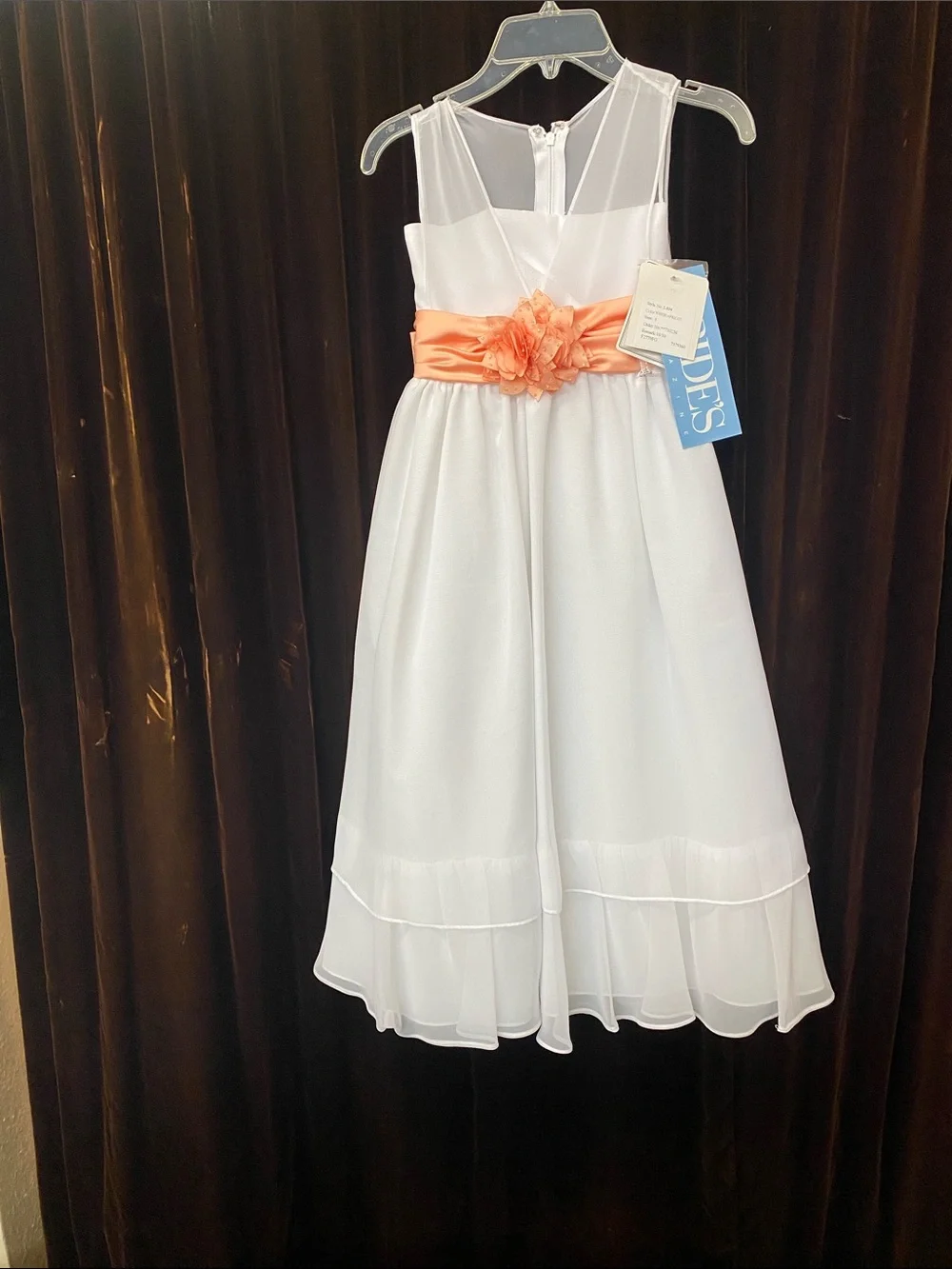 White Girls' Sleeveless Dress with Coral Sash and Floral Accent